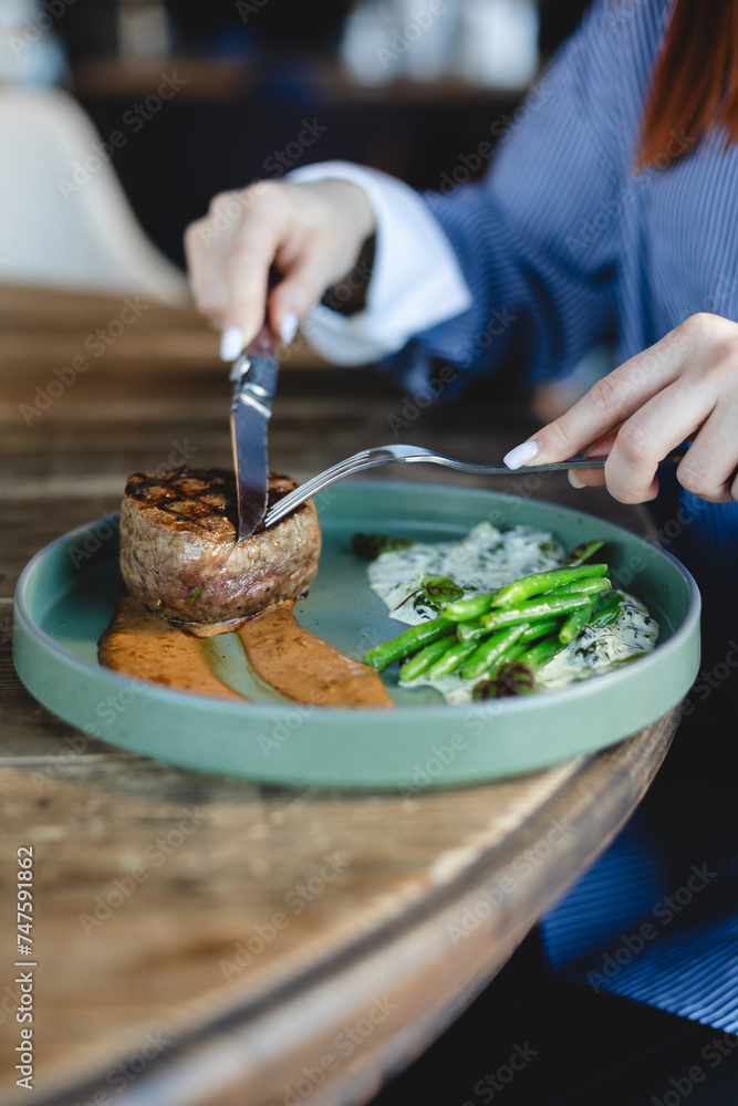 Appetizing pork medallion, steak with asparagus and sauce. Restaurant, banquet, buffet.