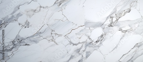 Detailed view of a white marble surface, showcasing the intricate patterns and textures of Statuario marble. This natural Carrara marble stone background is commonly used for interior design, photo