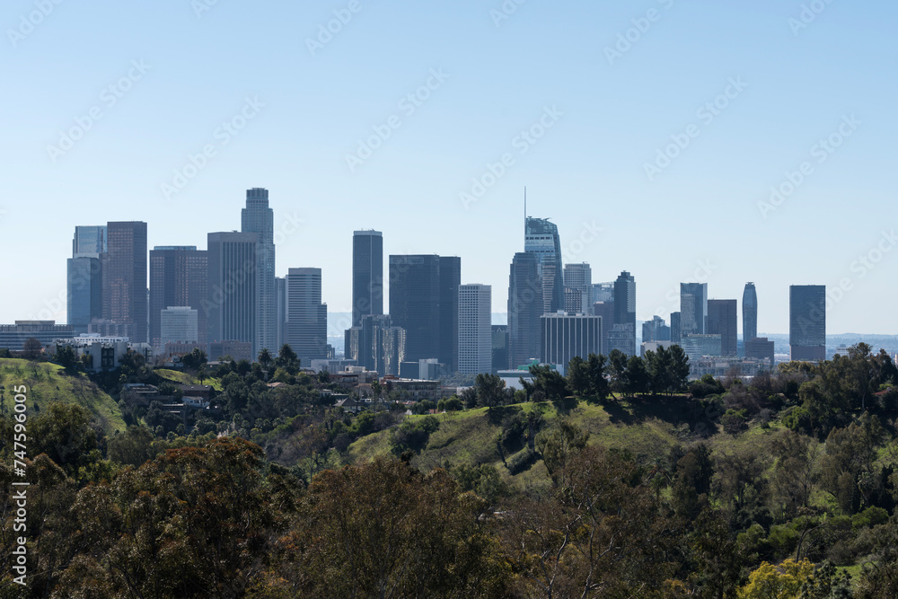 Downtown Los Angeles skyline with Elysian Park hillside in foreground.