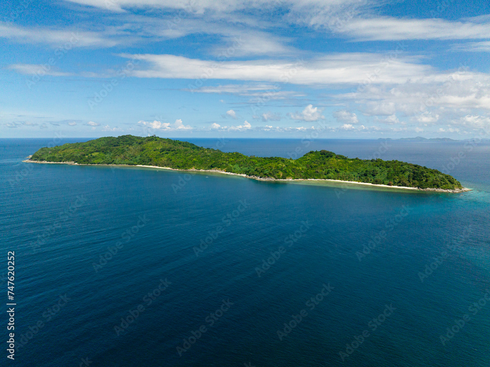 Blue sea and coastline with beaches in Cagbuli Island. El Nido, Palawan. Philippines.