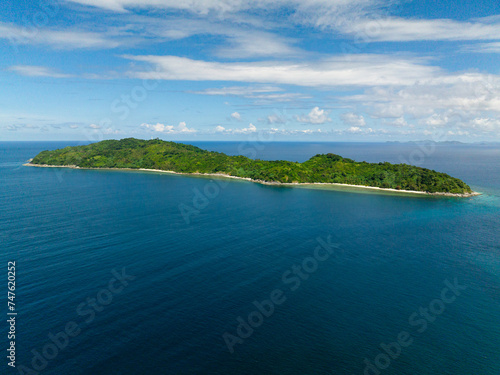 Blue sea and coastline with beaches in Cagbuli Island. El Nido, Palawan. Philippines.