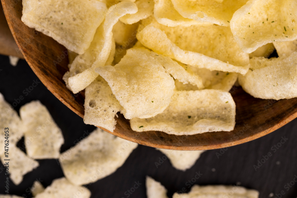crispy potato chips with spices on the table crispy potato chips with spices on the table