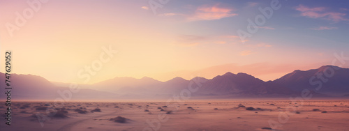 Desert Glow: Majestic Mountains under a Warm Sunset