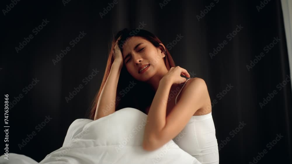 Beautiful asian woman have insomnia because of her stress problems and headaches or nightmare. She cannot sleep and at night with migraine. Young woman having period pain sleep troubles trying. Beautiful asian woman have insomnia because of her stress problems and headaches or nightmare. She cannot sleep and at night with migraine. Young woman having period pain sleep troubles trying.