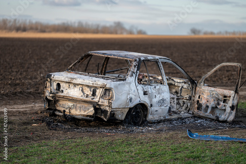A burned out car. Burnt car in the field. Car fire, vehicle fire due to short circuit. Stolen car intentional arson. One vehicle was damaged in the fire.