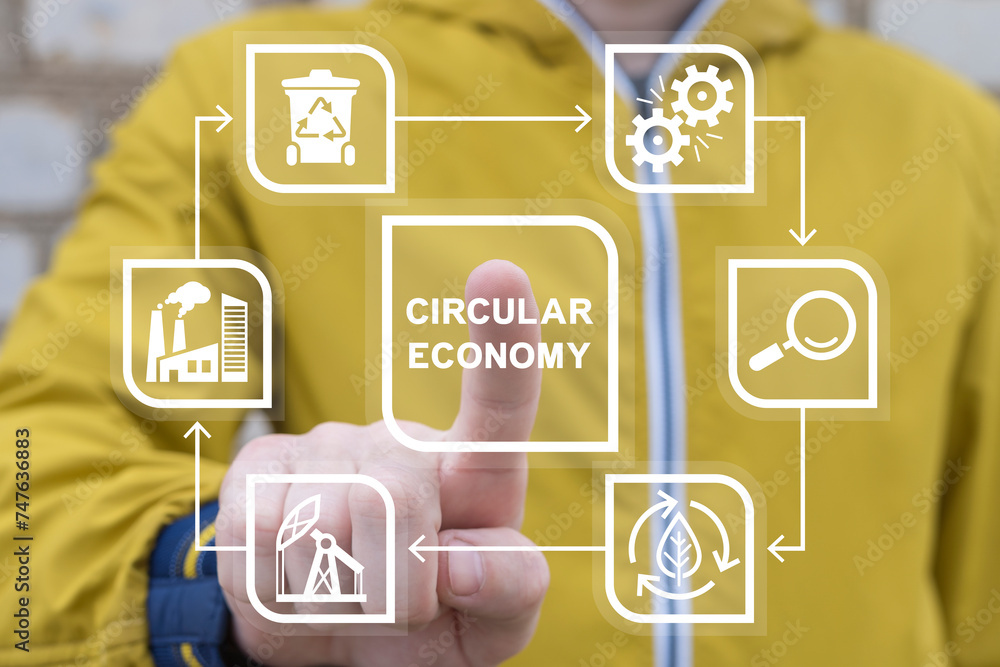 Man using virtual touch screen presses inscription: CIRCULAR ECONOMY. Concept of circular economy for future growth of business to reuse and renewable material resources and environment sustainable.