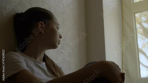 Solitude Sorrow: Young Woman's Grief by the Window at Home