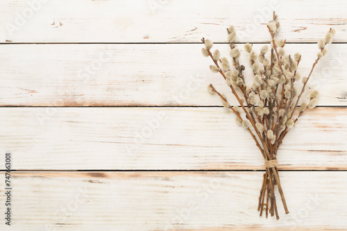 Pussy willow branches on wooden background, top, view. Palm Sunday concept
