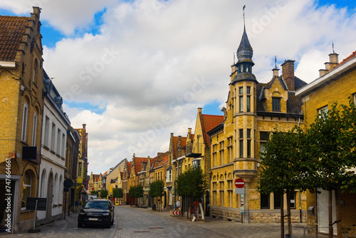 View of typical houses built in Flemish architectural style on summer street of old Belgian city of Diksmuide .