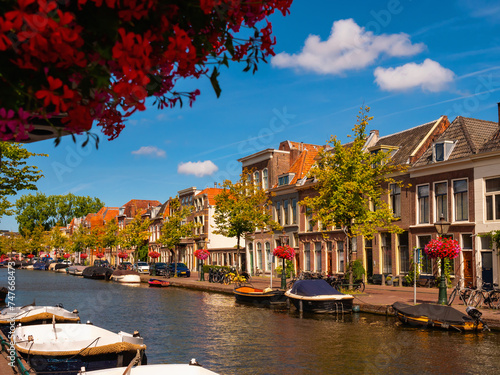 Streets along canal of Leiden, city in Province of South Holland, Netherlands.