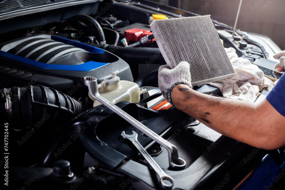 Car air conditioner system maintenance, Hand mechanic holding car air filter to check for clean dirty or fix repair heat have a problem or replace new or change filter. - obrazy, fototapety, plakaty 
