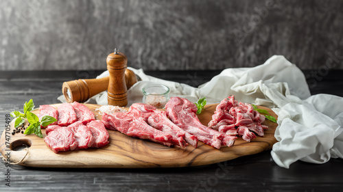 Raw lamb meat in various parts on a wooden plate © mnimage