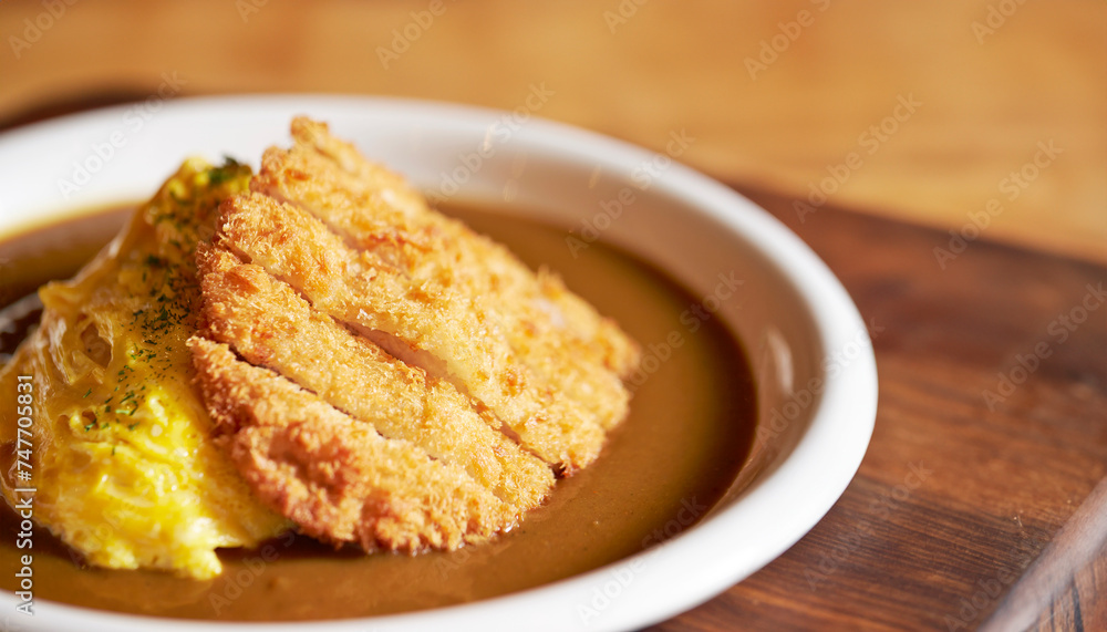 Pork cutlet with delicious Curry sauce on a plate Pork cutlet with delicious Curry sauce on a plate