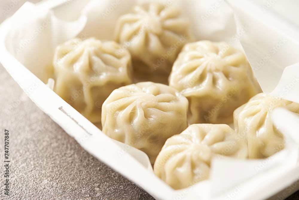 Steamed dumplings in a packaging container Steamed dumplings in a packaging container