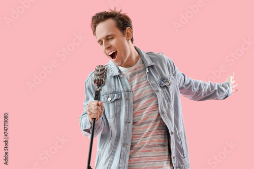 Emotional young man singing...