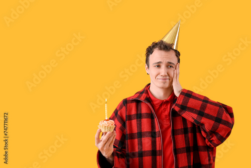 Sad young man with birthday...