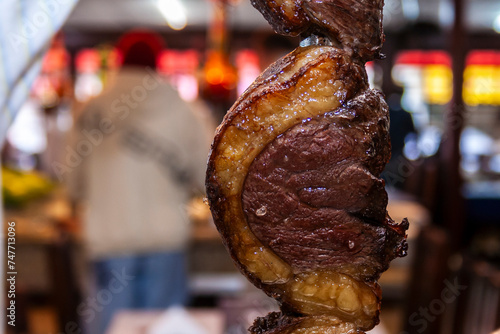 Brazilian style beef ribs Barbecue grill on skewers  at a churrascaria steakhouse in Brazil. photo