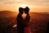 Silhouette of Bride and Groom Embracing at Sunset with Scenic City Background