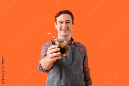 Young male bartender with g...