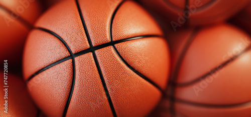 Close-up shot of orange basketball The background is orange. © phaisarnwong2517