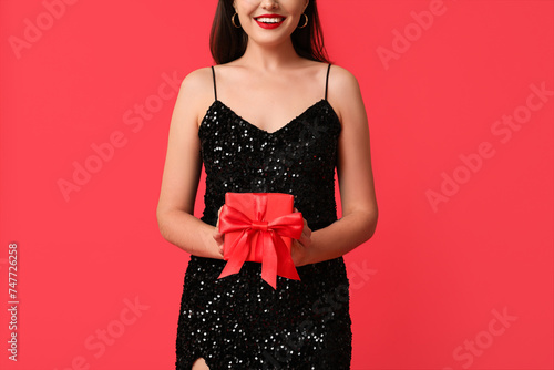 Smiling woman in sequin dre...