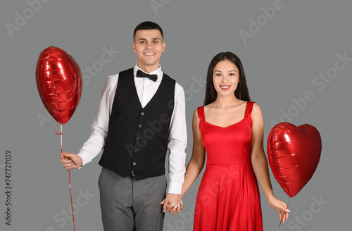 Elegant young couple holdin...