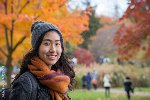 Student enjoying the vibrant fall colors in a park Embodying the essence of autumn and academic life