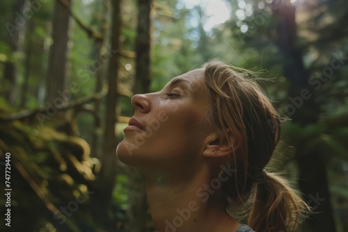 Woman enjoying the serenity of a forest Taking a deep breath of fresh air Connecting with nature and finding peace in the great outdoors