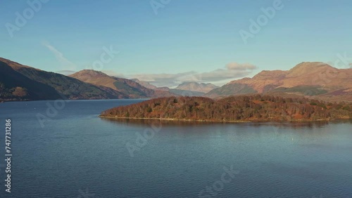 Lake Lomond and The Trossachs National Park with an Aerial Drone Panning the Beautiful Landscape During Autumn in Scotland. photo