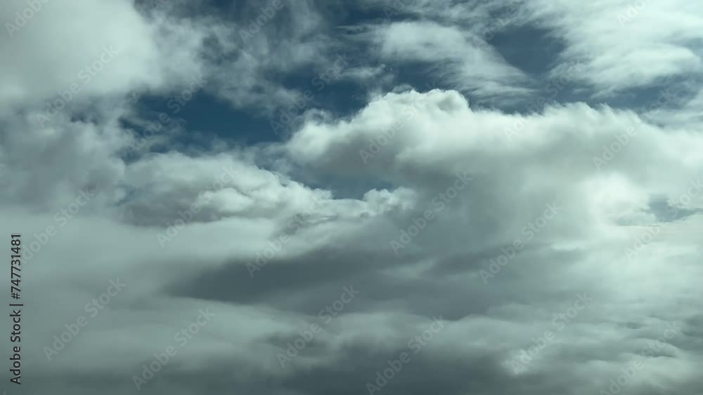 Cloudscape POV, pilot perspective shot in a real time flight across a partially clouded sky. Daylight with a deep blue sky. 4K 60FPS Cloudscape POV, pilot perspective shot in a real time flight across a partially clouded sky. Daylight with a deep blue sky. 4K 60FPS