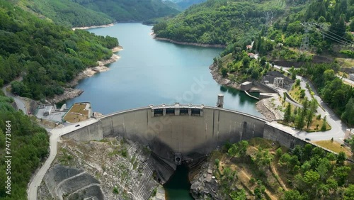Dam aerial shot in northern Portugal, Salamonde, Montalegre, Portugal, aerial shot on a sunny day geres national park, Zoom out photo
