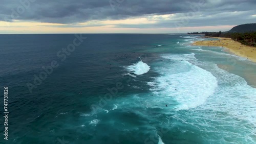 Aerial view of Ehukai Beach Park, Surfers riding waves at famous Banzai Pipeline, Ohau. Hawaii photo