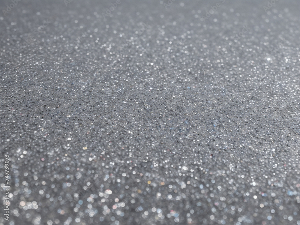 Blurred bokeh light on gray silver background. New Year holidays template. Abstract glitter defocused blinking stars and sparks. Blurred bokeh light on gray silver background. New Year holidays template. Abstract glitter defocused blinking stars and sparks.