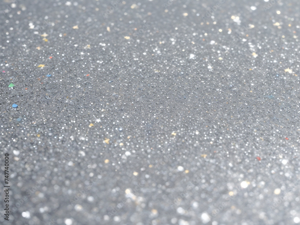 Blurred bokeh light on gray silver background. New Year holidays template. Abstract glitter defocused blinking stars and sparks. Blurred bokeh light on gray silver background. New Year holidays template. Abstract glitter defocused blinking stars and sparks.