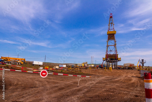 oil and gas drilling rig on a summer sunny day against a blue sky