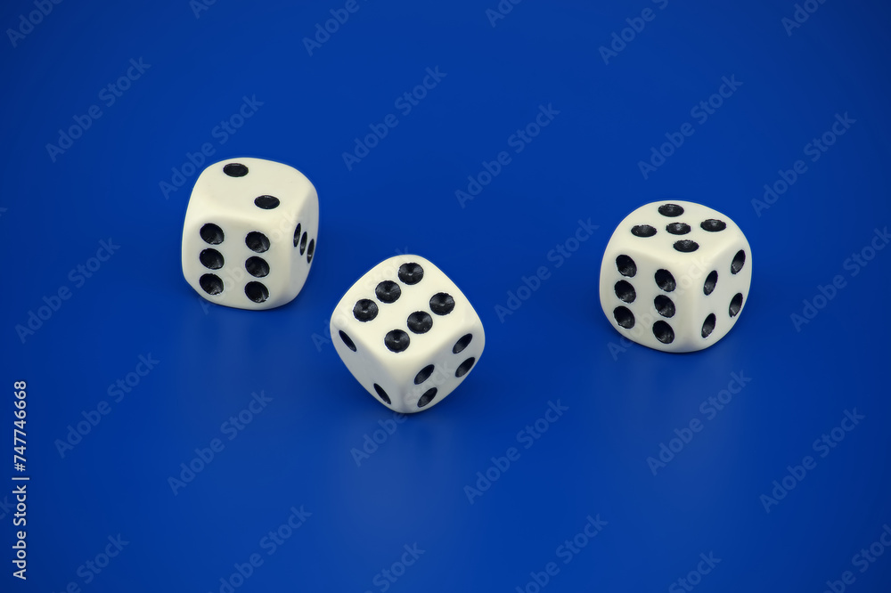 Gaming scene with three dice on blue background Gaming scene with three dice on blue background