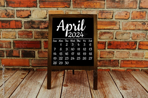 April 2024 monthly calendar on chalkboard for planning and management