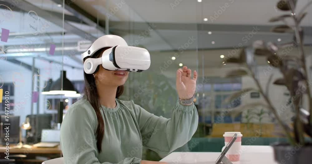 Asian woman explores virtual reality in a modern office setting Asian woman explores virtual reality in a modern office setting