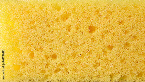 New yellow sponge as background, closeup view; space for text or image