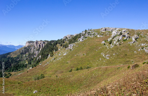 Walking along the subalpine in early autumn, the opening of the tourist season,a panorama of the mountainous terrain.