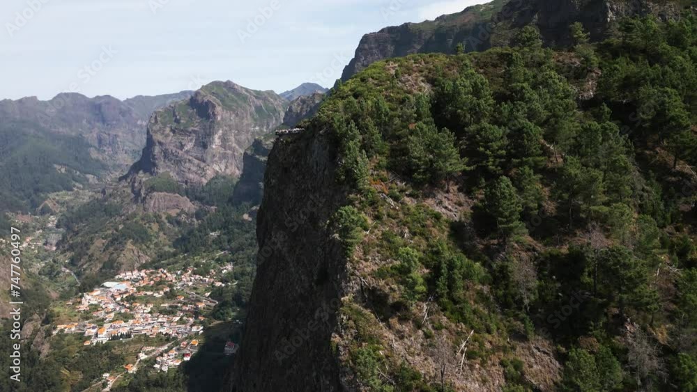 small village in a green valley in madeira, viewpoint on a big green mountain, big mountain, portugal, drone, aerial small village in a green valley in madeira, viewpoint on a big green mountain, big mountain, portugal, drone, aerial