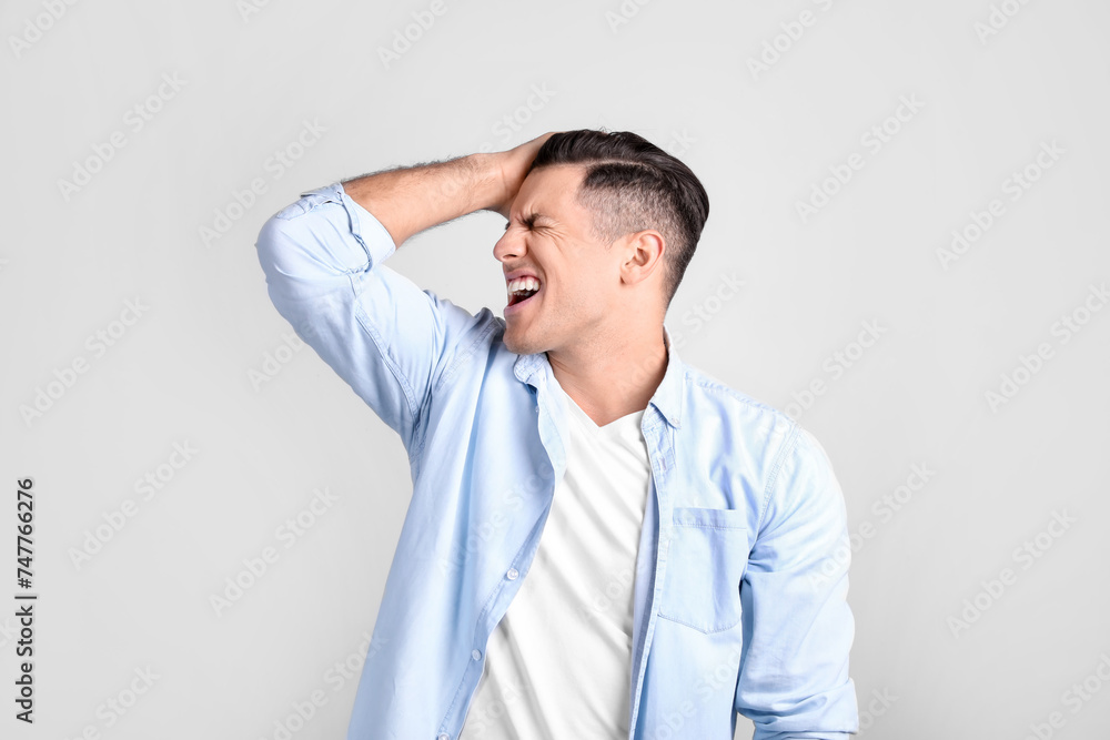 Portrait of stressed man on light background Portrait of stressed man on light background