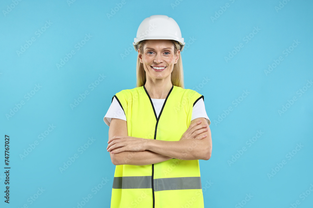 Engineer in hard hat on light blue background Engineer in hard hat on light blue background