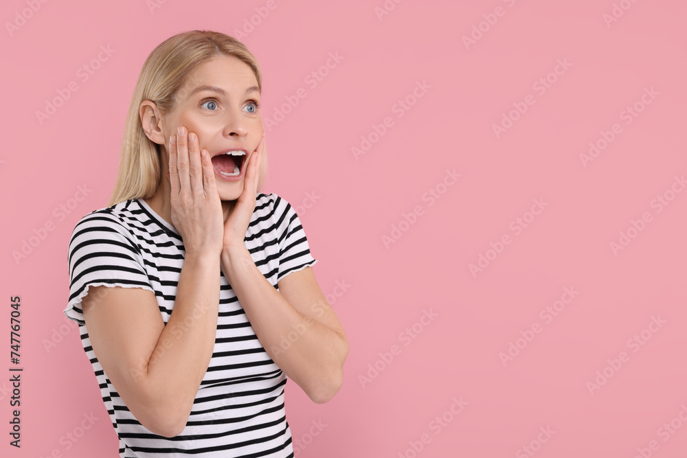 Portrait of surprised woman on pink background, space for text Portrait of surprised woman on pink background, space for text