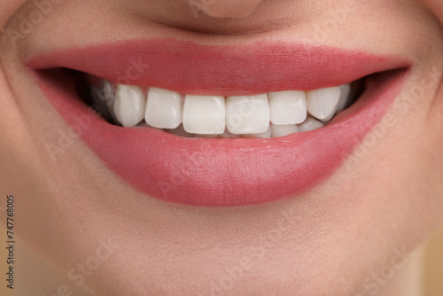 Young woman with beautiful smile as background, closeup