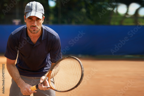 Tennis, game and portrait of man on court for sport, competition or exercise for fitness. Athlete, workout and play on pitch outdoor in summer with action, challenge and person in contest mock up © Katie/peopleimages.com