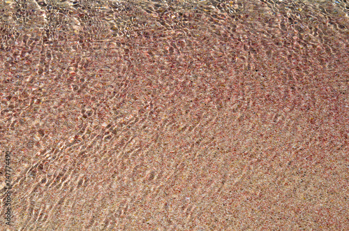 Wave on pink sand beach, background