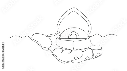 Continuous single line sketch drawing of hand holding wedding couple rings in open elegant box. One line art of engagement and love marriage symbol vector illustration
