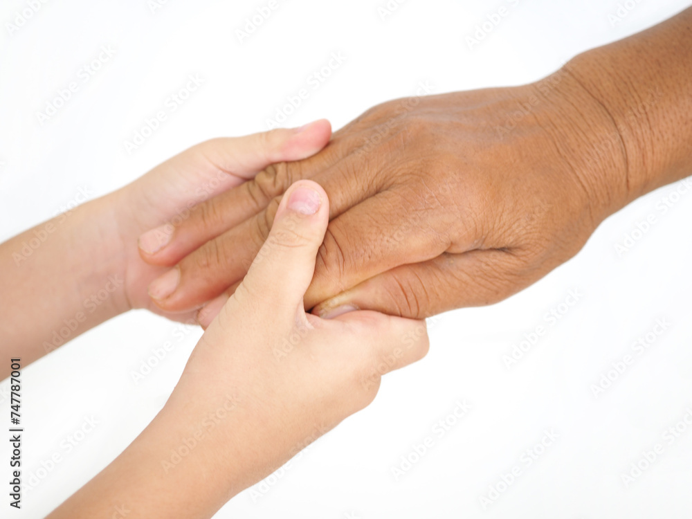 Grandmother and child little boy holding hand together with love. Grandmother and child little boy holding hand together with love.