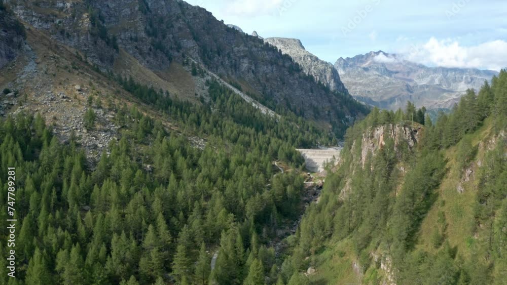 Mountain valley with lush greenery and clear skies at Lago di Devero, Alpe Devero, aerial view Mountain valley with lush greenery and clear skies at Lago di Devero, Alpe Devero, aerial view